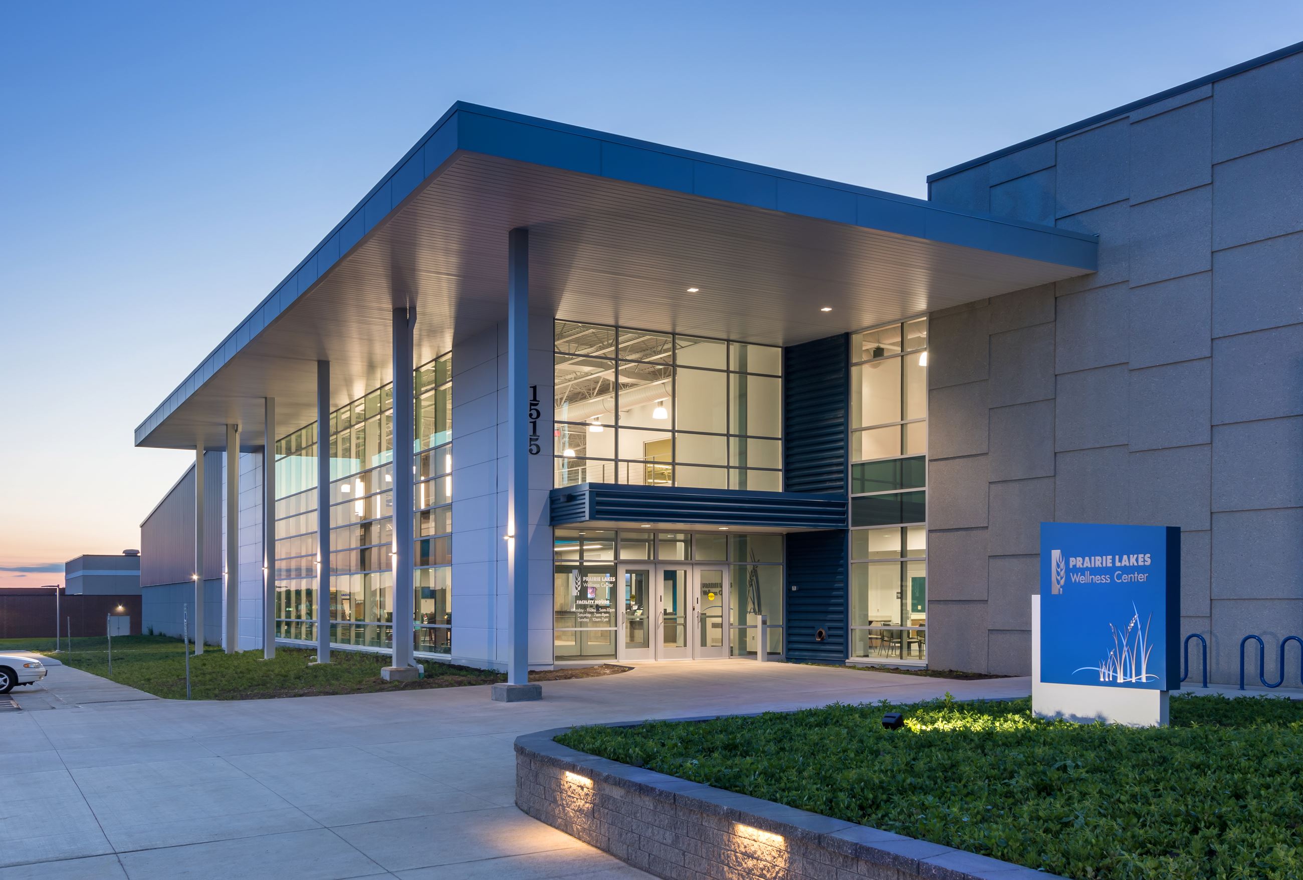 A nighttime view of the entrance to Prairie Lakes Wellness Center