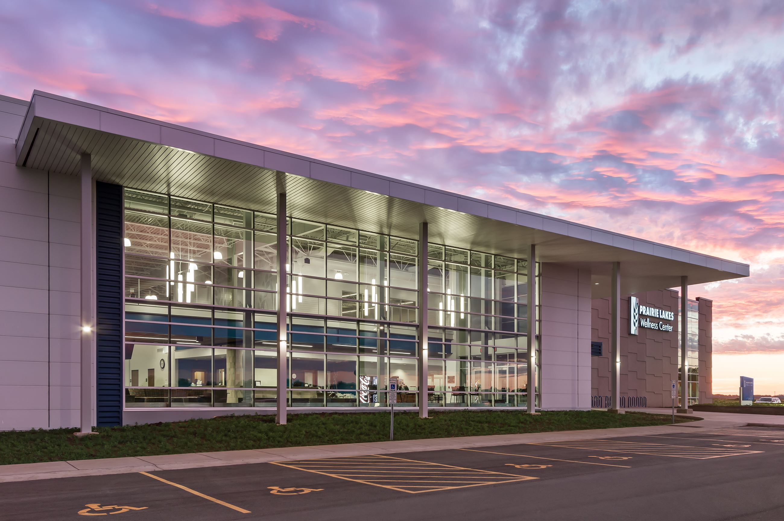 A nighttime view of the entrance to Prairie Lakes Wellness Center