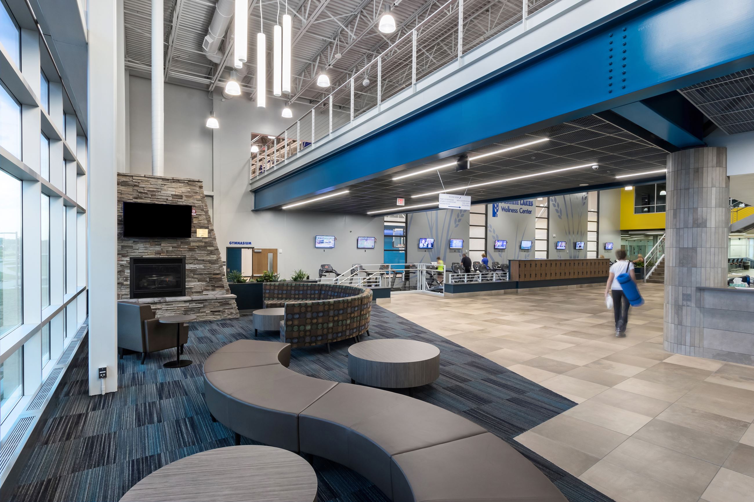 The lobby area of a fitness facility with seating