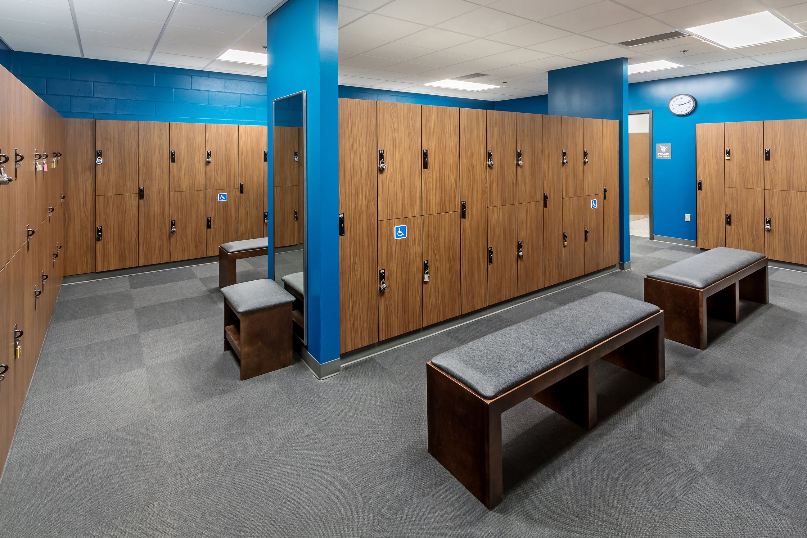 A locker room and benches in a fitness facility